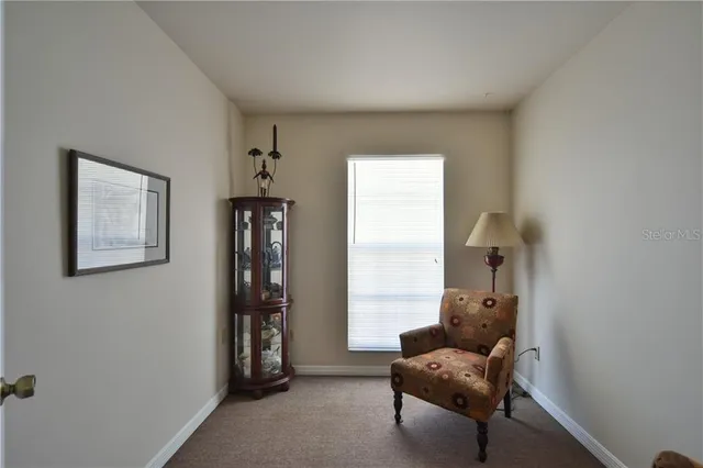 a view of a house with a yard porch and sitting area