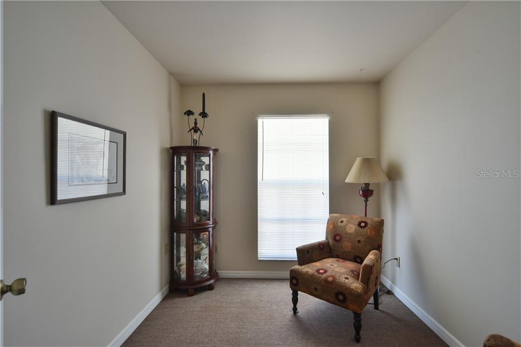 5208 Northeast 24th Street Ocala, FL 34470 - Photo 23 of 31 a living room with furniture and a window