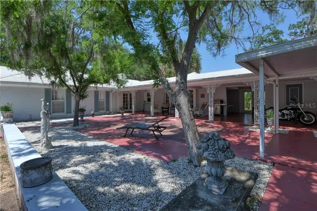 a view of a patio with swimming pool