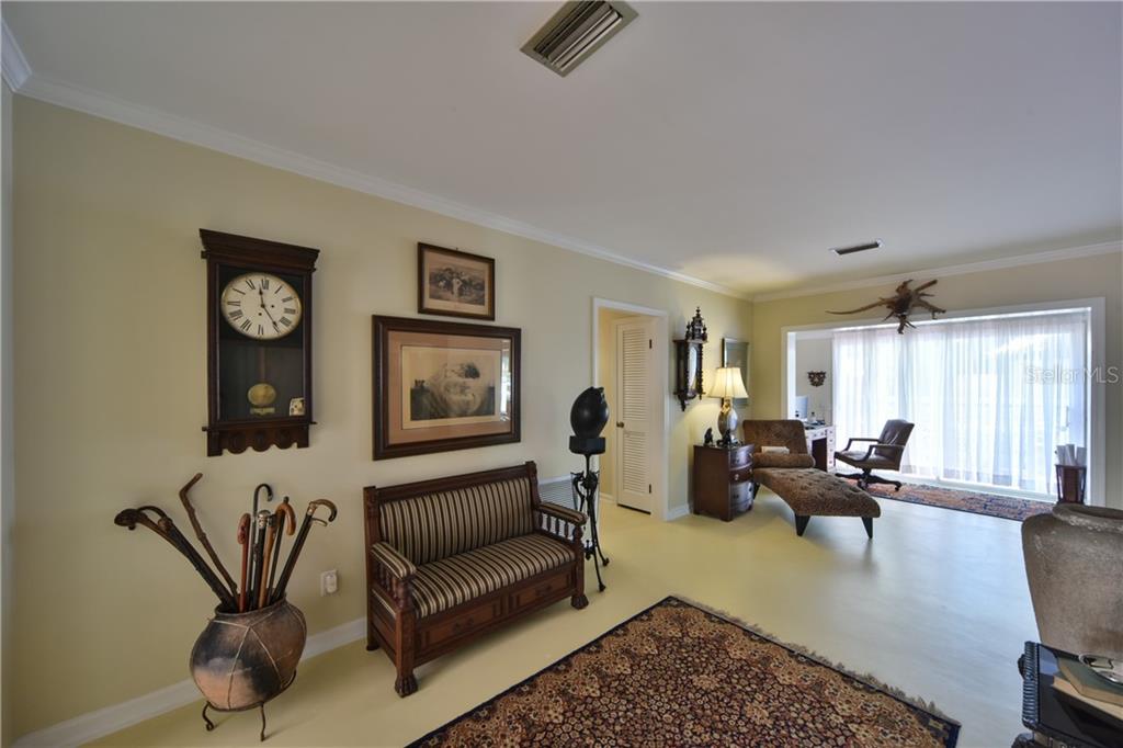 5208 Northeast 24th Street Ocala, FL 34470 - Photo 5 of 31 a living room with furniture wooden floor and window