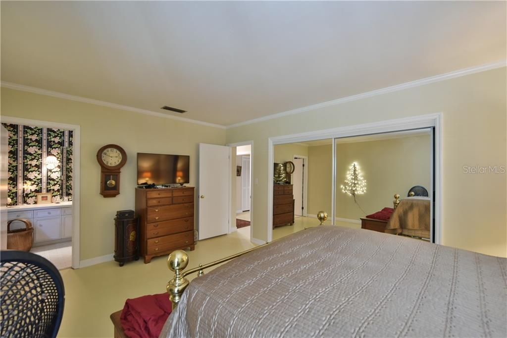 5208 Northeast 24th Street Ocala, FL 34470 - Photo 10 of 31 a bedroom with furniture and a closet