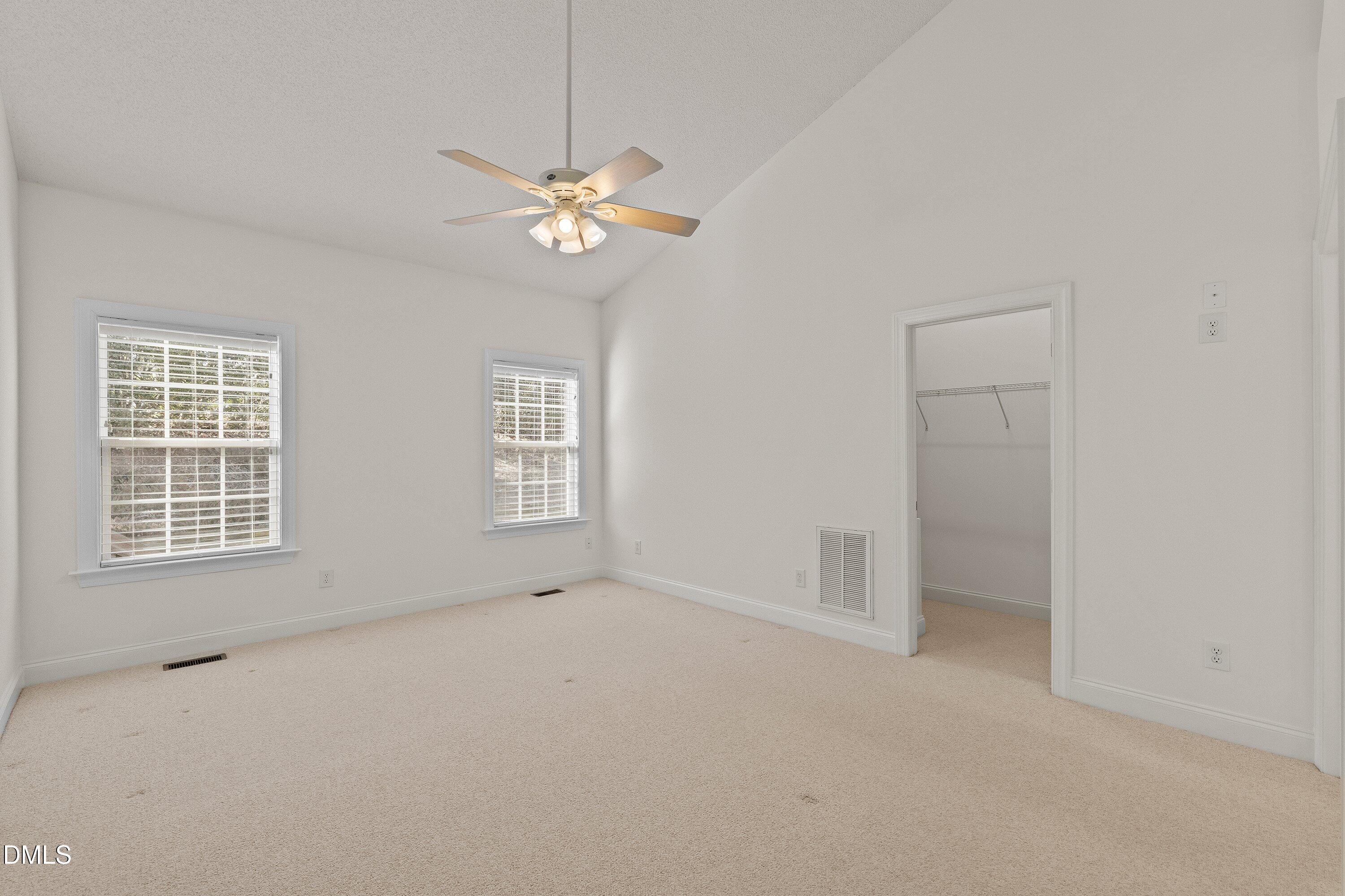 105 Rockport Ridge Way Cary, NC 27519 - Photo 28 of 43 an empty room with chandelier fan