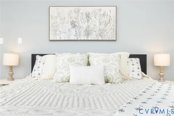 a view of a lake with houses in the back