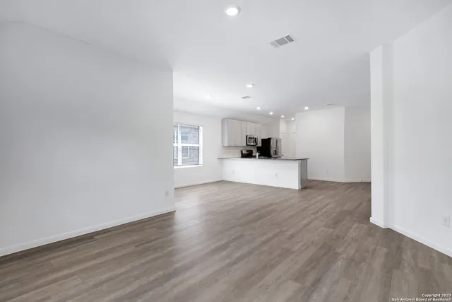 a view of a kitchen with a sink and a stove top oven
