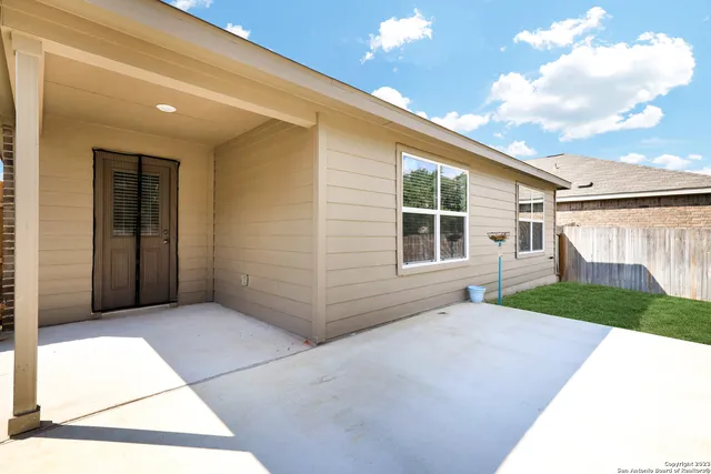 a house view with a backyard space