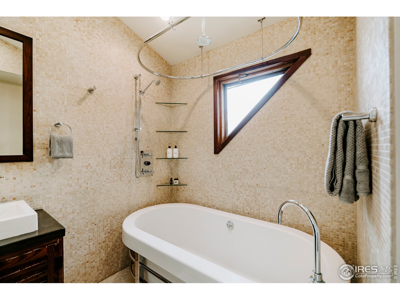 1718 Mapleton Avenue Boulder, CO 80302 - Photo 29 of 40 a bathroom with a sink a bathtub and a shower