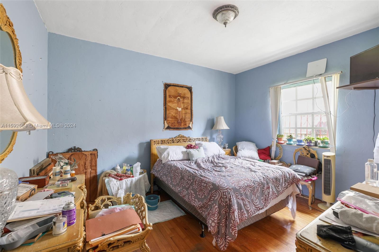 445 Southwest 20th Road Miami, FL 33129 - Photo 6 of 13 a bedroom with a bed and a window