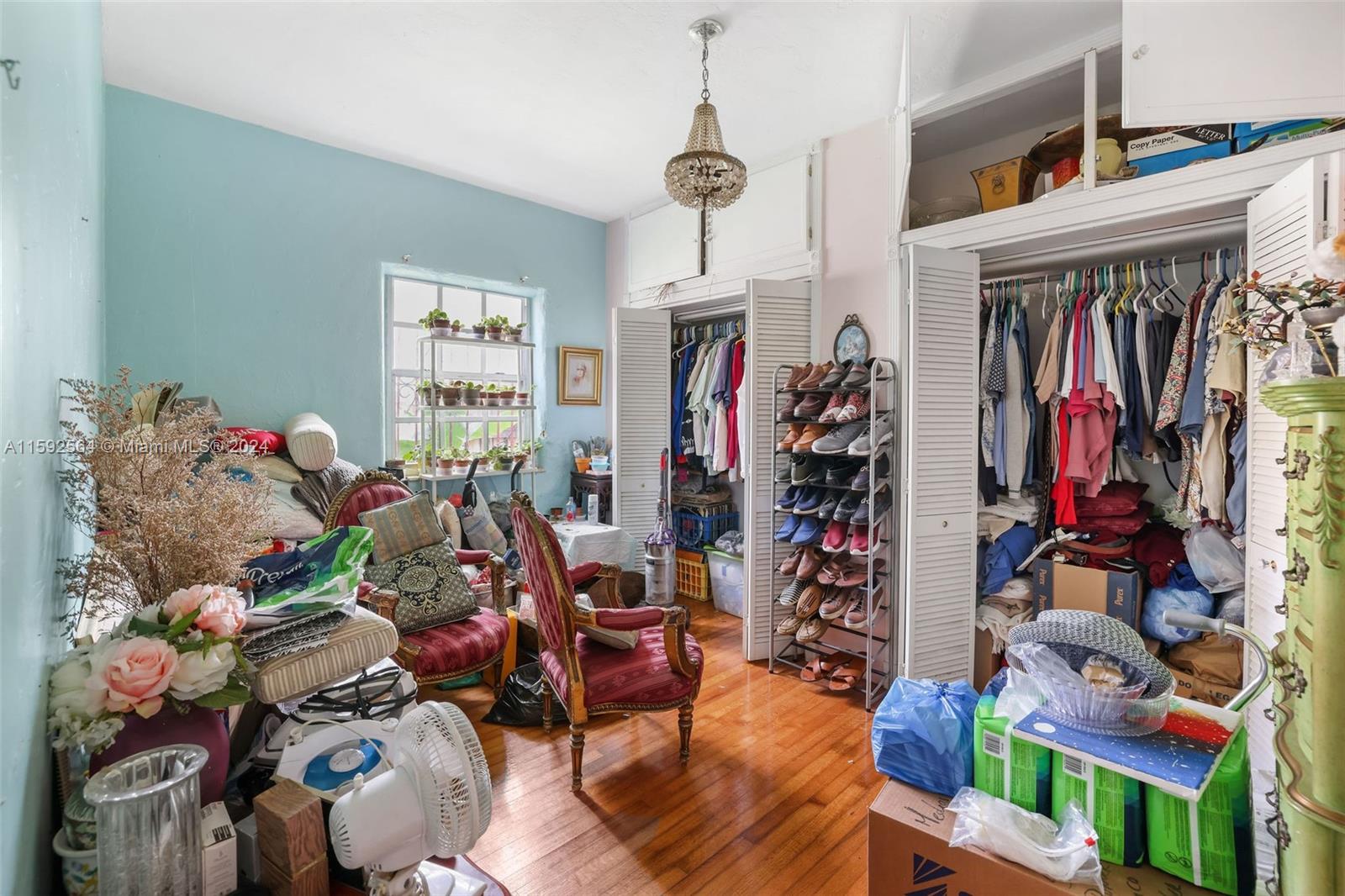 445 Southwest 20th Road Miami, FL 33129 - Photo 7 of 13 a living room filled with furniture and a window
