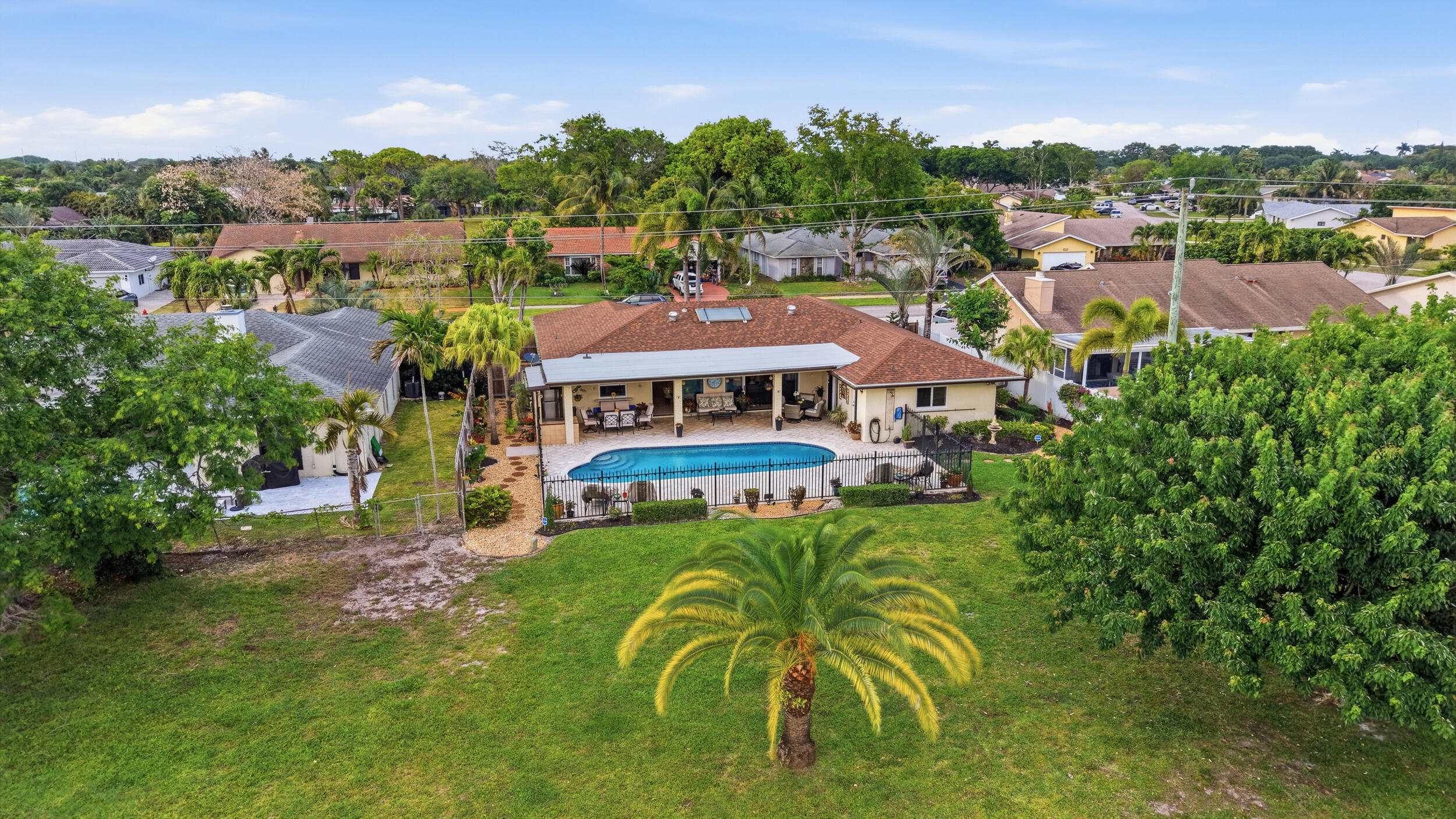 4780 Brandywine Drive Boca Raton, FL 33487 - Photo 3 of 43 a view of a house with a big yard