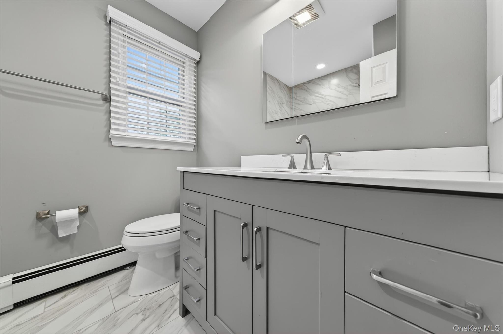 155 Pine Tree Road Monroe, NY 10950 - Photo 31 of 49 a bathroom with a sink a toilet and a mirror