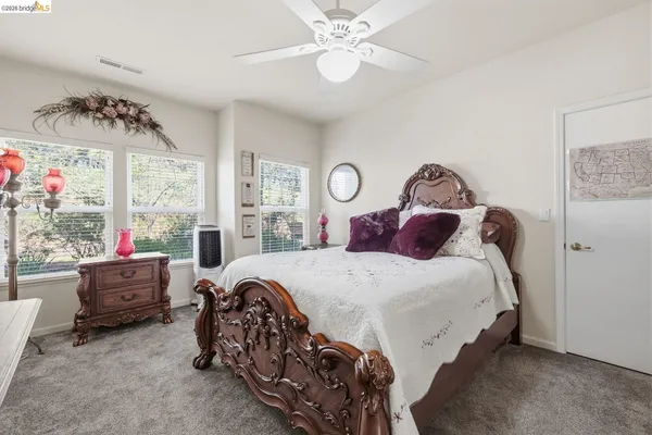a bedroom with bed and window