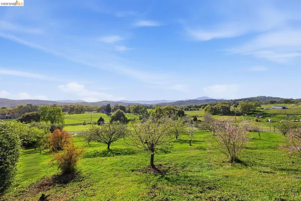 a view of lake with green space