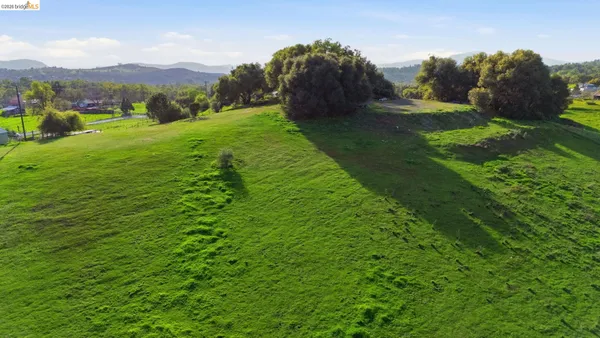 an aerial view of a golf course with a yard