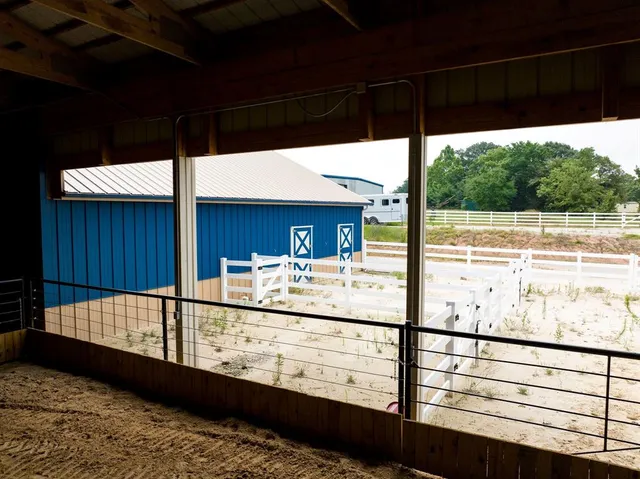 a view of a balcony with a couple of people sitting on deck