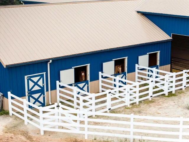 a view of a dinning room and kitchen with stainless steel appliances