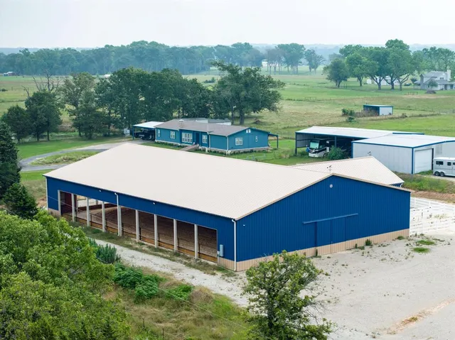 a aerial view of a house with a yard