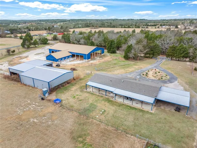 an aerial view of a house with a swimming pool