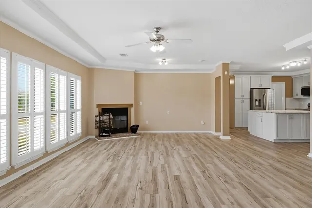 a view of livingroom with hardwood floor and a ceiling fan