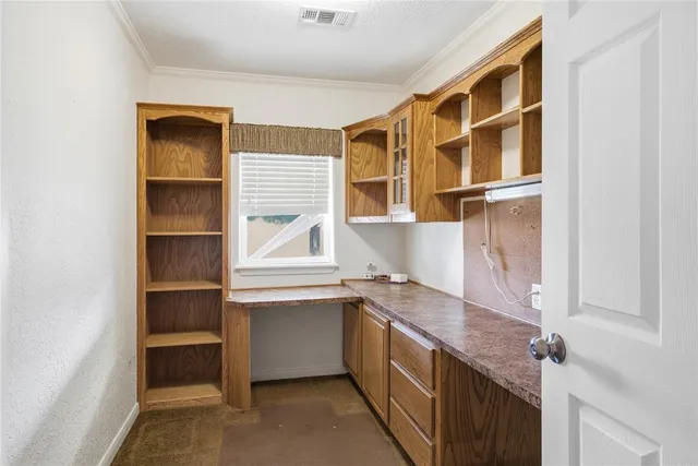 a kitchen with a cabinets and wooden floor