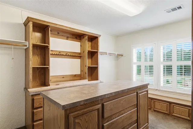 a kitchen with a sink and a window