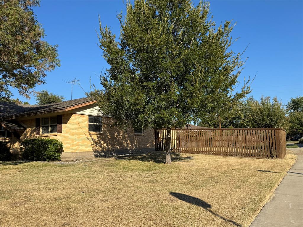 1900 Provincetown Lane Richardson, TX 75080 - Photo 3 of 14 a view of a white house with a yard