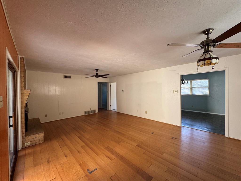 1900 Provincetown Lane Richardson, TX 75080 - Photo 6 of 14 wooden floor in an empty room with a window
