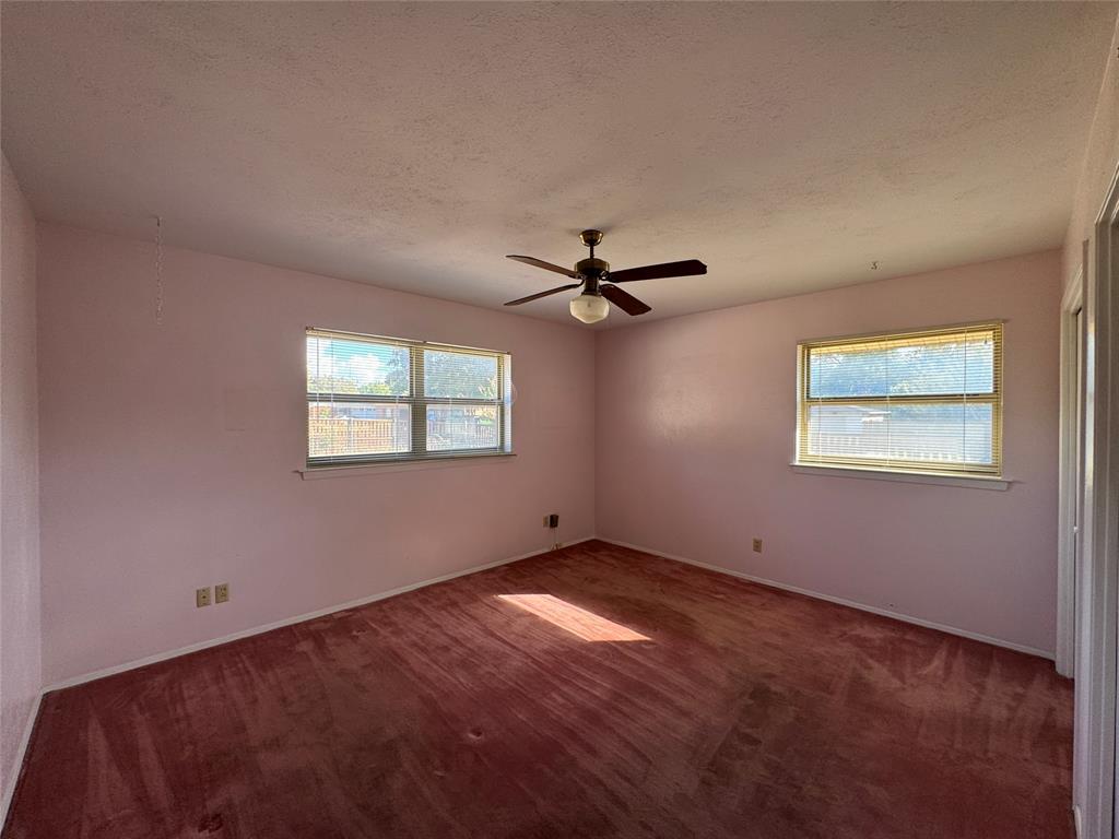 1900 Provincetown Lane Richardson, TX 75080 - Photo 7 of 14 a view of a big room with wooden floor closet and windows