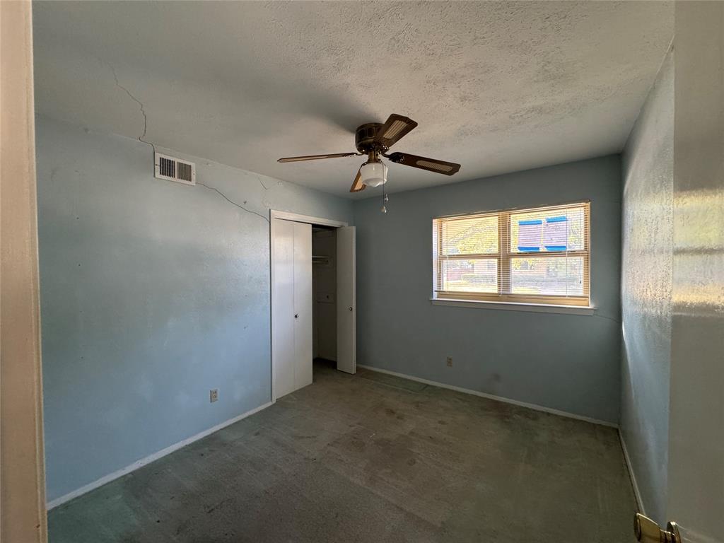 1900 Provincetown Lane Richardson, TX 75080 - Photo 9 of 14 a view of an empty room with a window