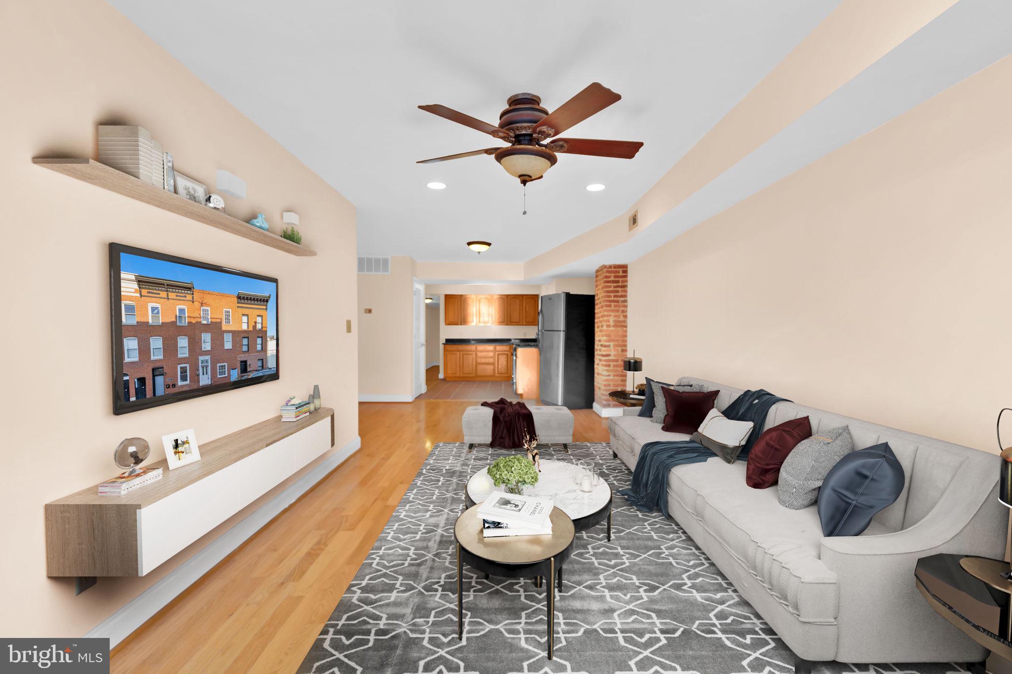 1447 William Street Baltimore, MD 21230 - Photo 22 of 65 a living room with furniture and a flat screen tv