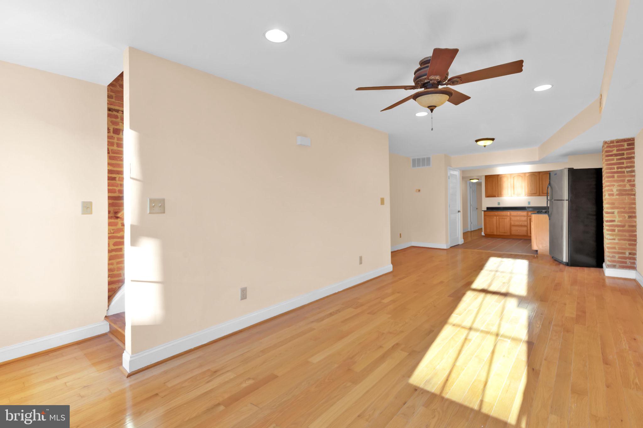 1447 William Street Baltimore, MD 21230 - Photo 24 of 65 a view of empty room with wooden floor and fan
