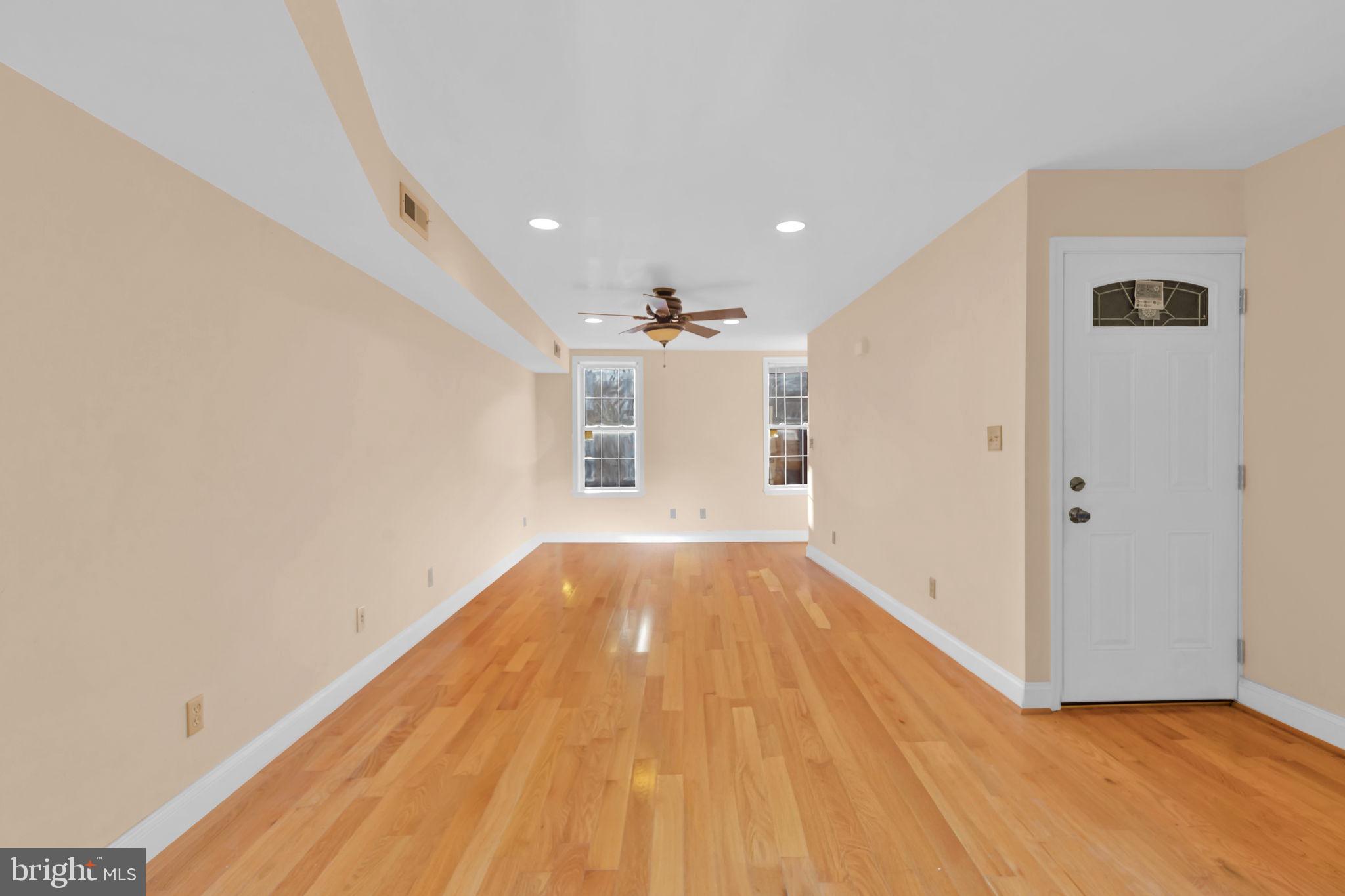 1447 William Street Baltimore, MD 21230 - Photo 25 of 65 wooden floor in an empty room with a window