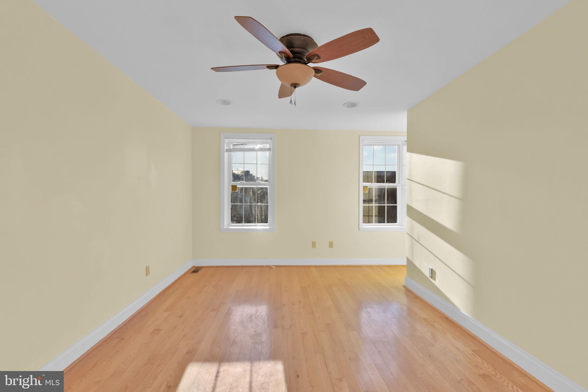 1447 William Street Baltimore, MD 21230 - Photo 34 of 65 wooden floor in an empty room with a window