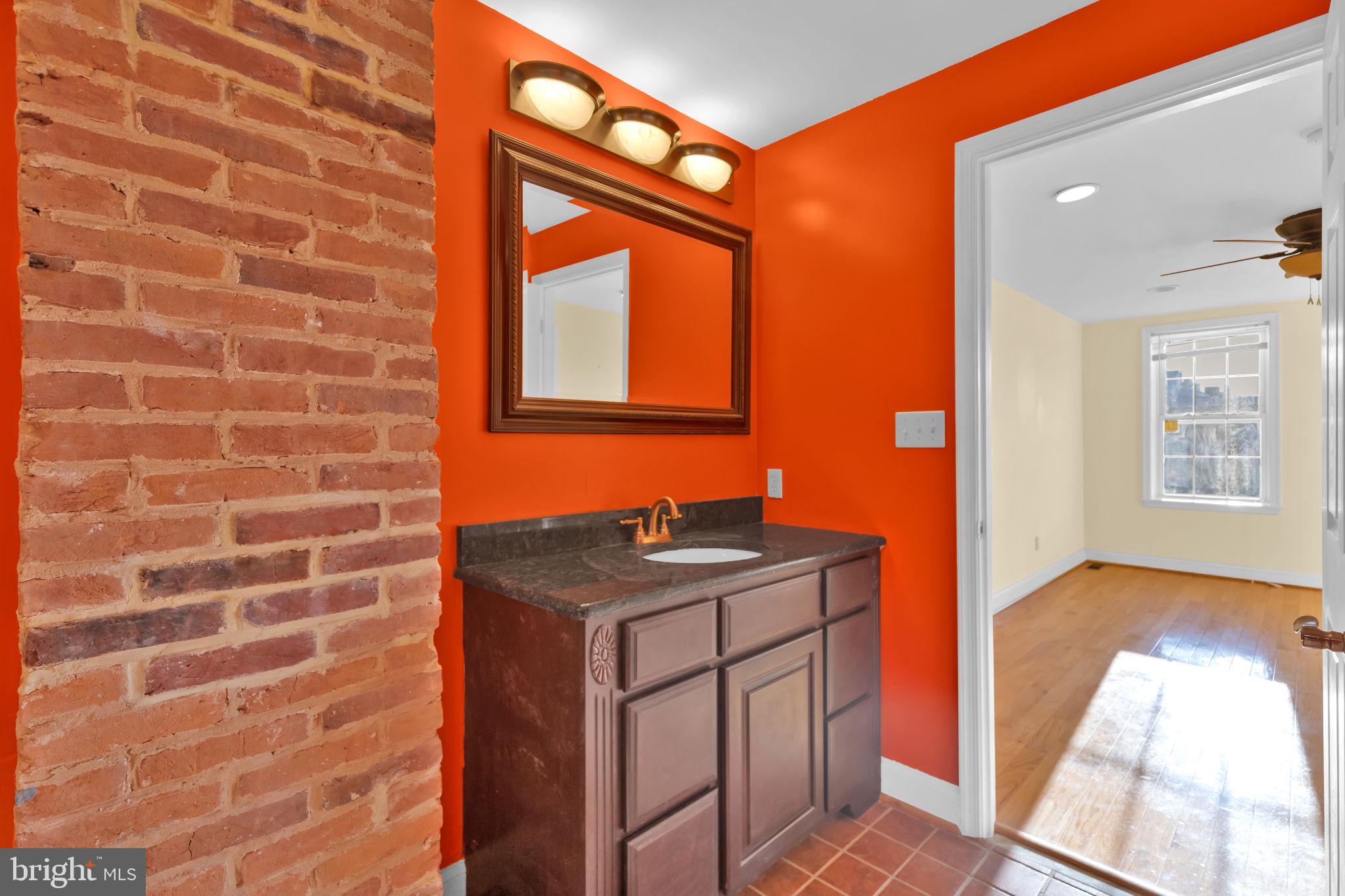 1447 William Street Baltimore, MD 21230 - Photo 36 of 65 a bath room with a sink and a mirror