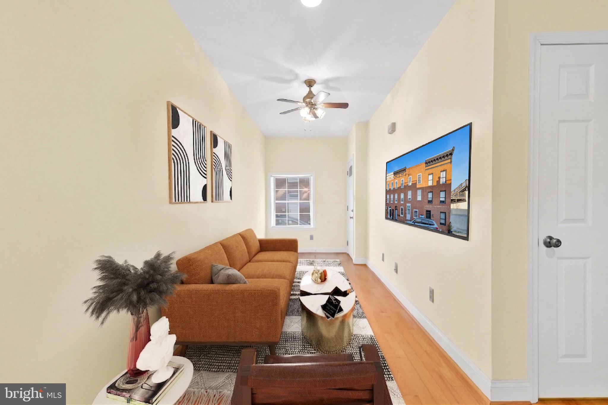 1447 William Street Baltimore, MD 21230 - Photo 4 of 65 a living room with furniture and a flat screen tv