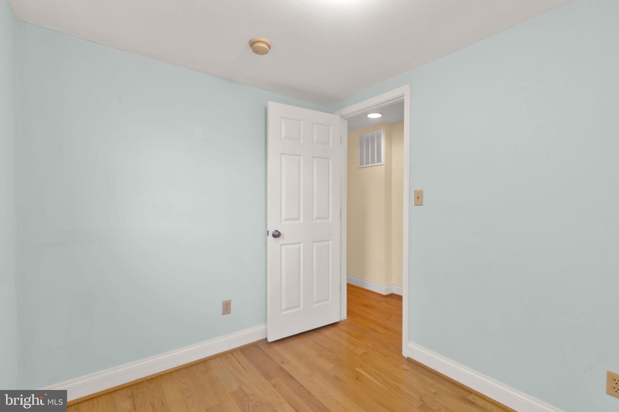 1447 William Street Baltimore, MD 21230 - Photo 42 of 65 a view of an empty room with wooden floor