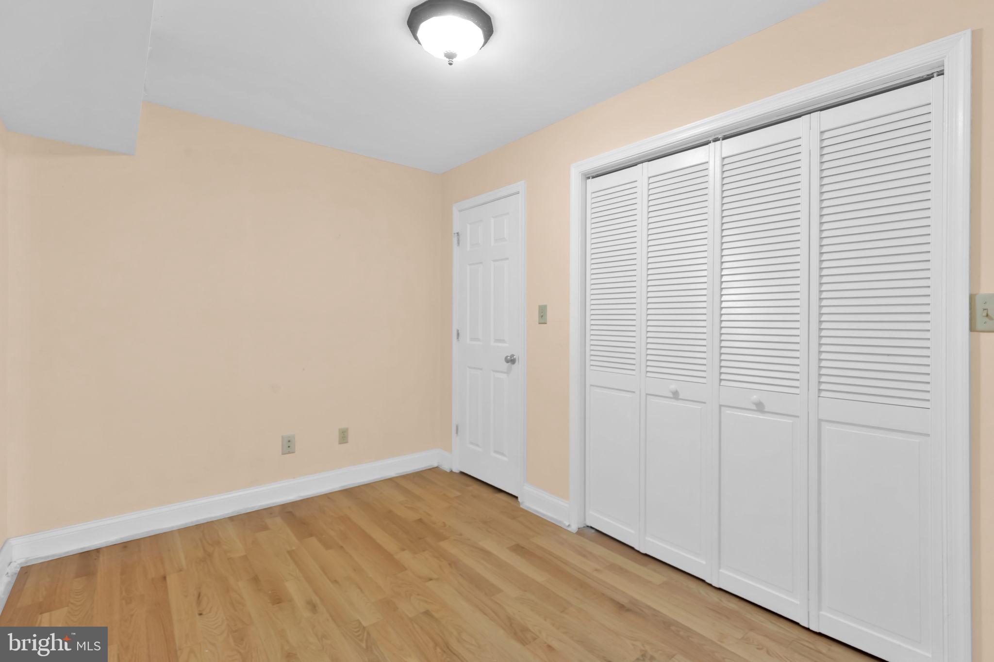 1447 William Street Baltimore, MD 21230 - Photo 46 of 65 an empty room with a wooden floor