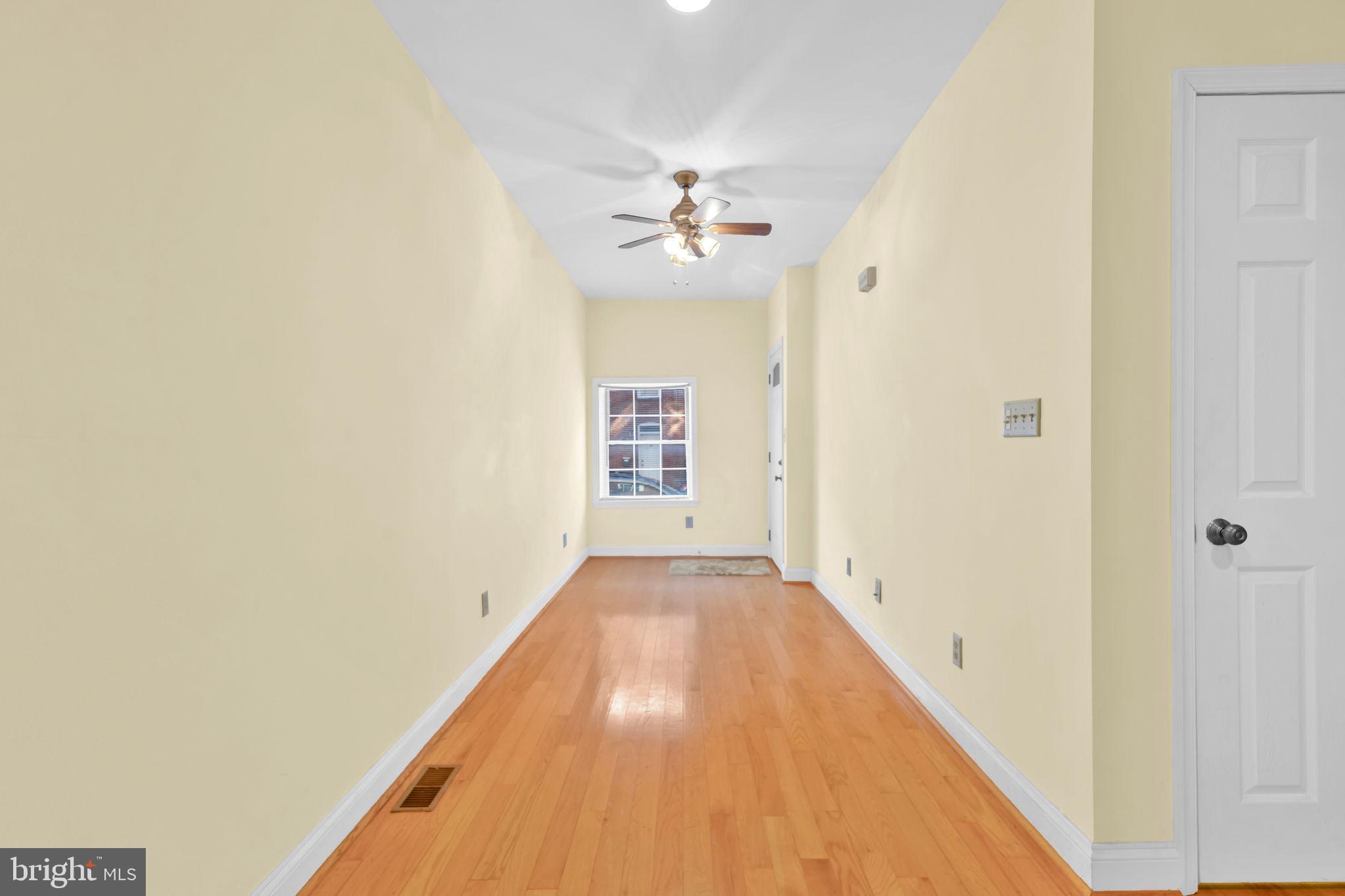 1447 William Street Baltimore, MD 21230 - Photo 5 of 65 a view of a hallway with a chandelier fan