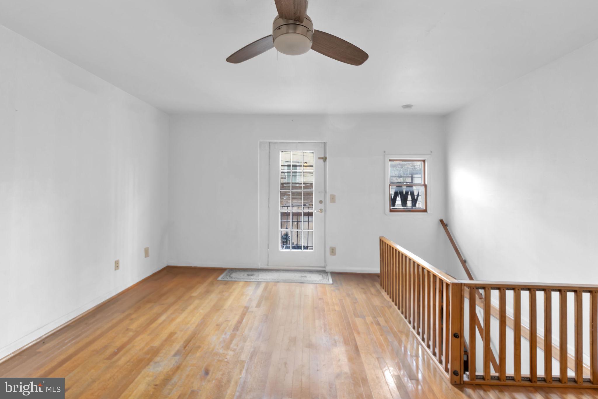 1447 William Street Baltimore, MD 21230 - Photo 54 of 65 a view of livingroom with hardwood floor and window