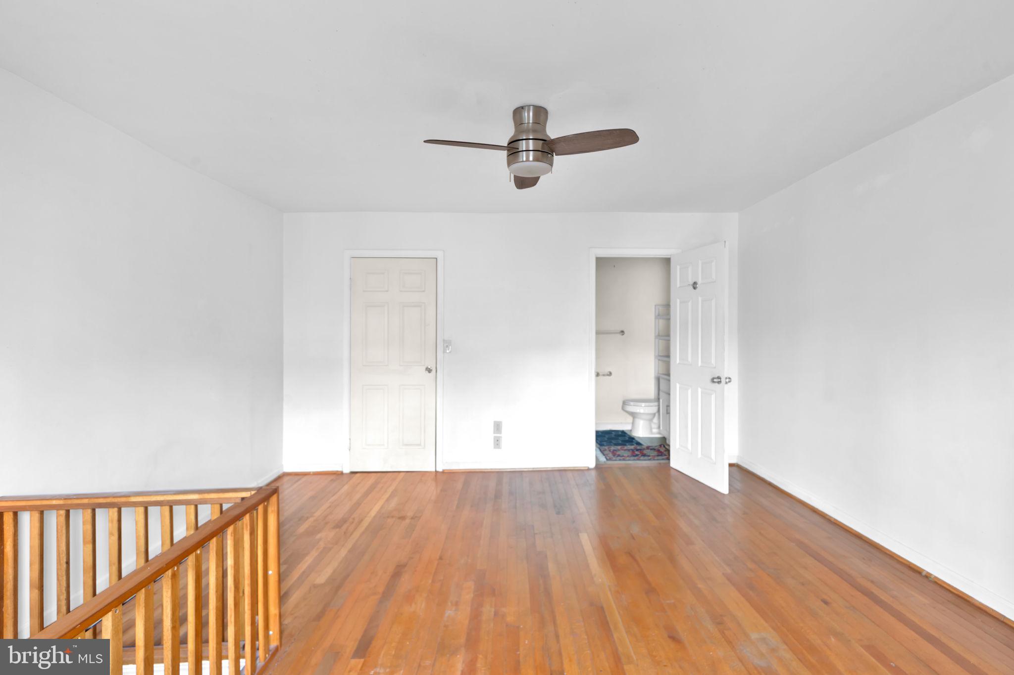 1447 William Street Baltimore, MD 21230 - Photo 55 of 65 a view of a room with wooden floor and white walls
