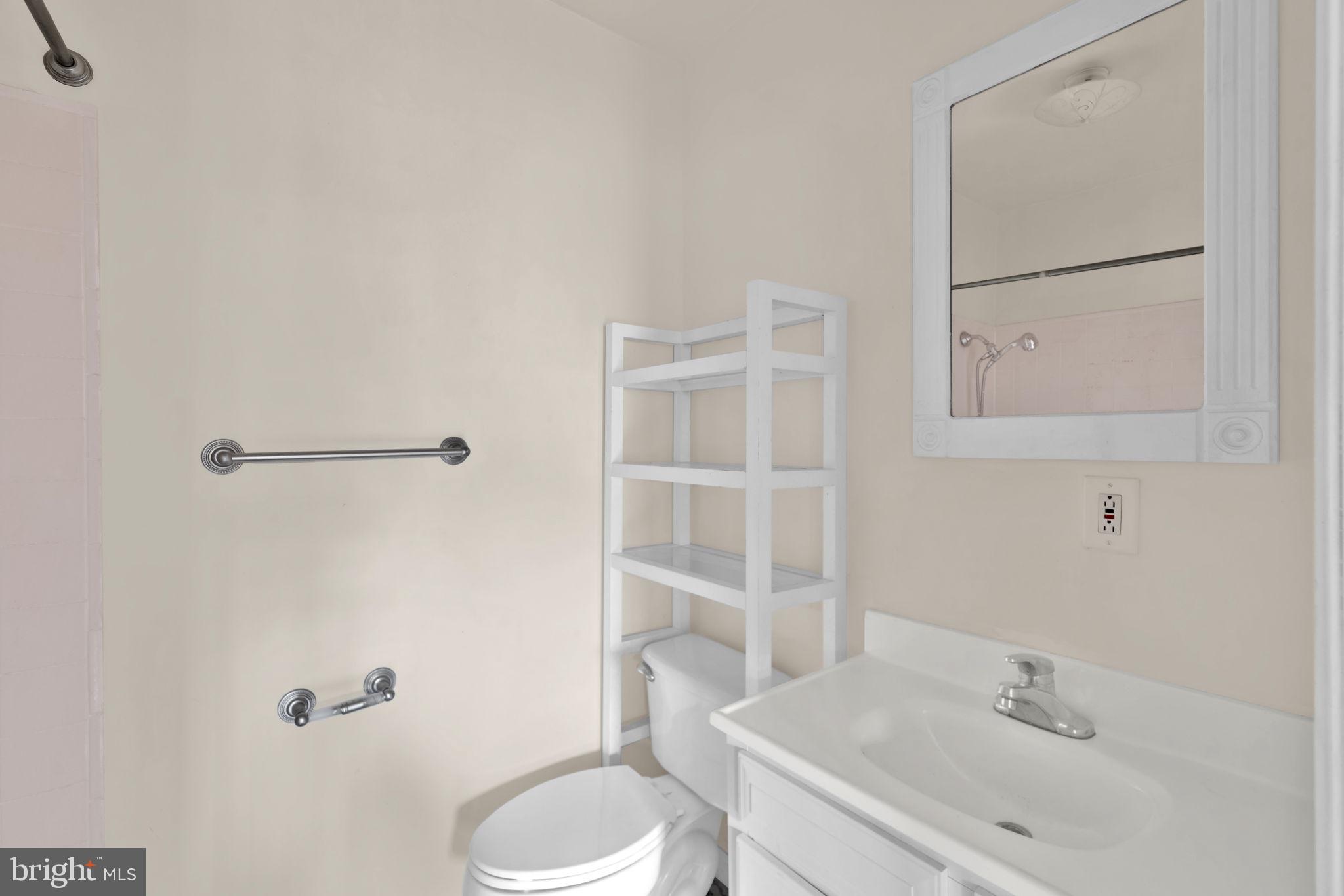 1447 William Street Baltimore, MD 21230 - Photo 57 of 65 a bathroom with a sink a toilet and shower