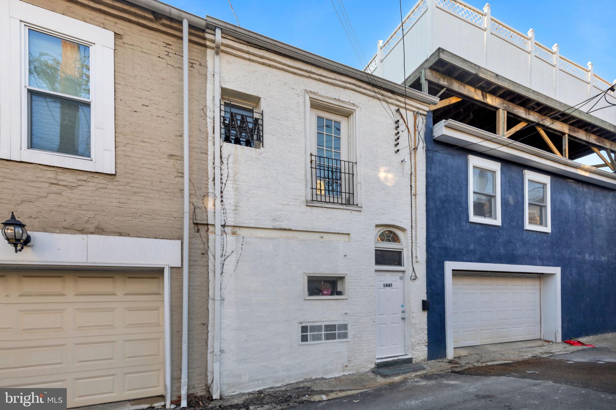 1447 William Street Baltimore, MD 21230 - Photo 58 of 65 a front view of a house with a garage