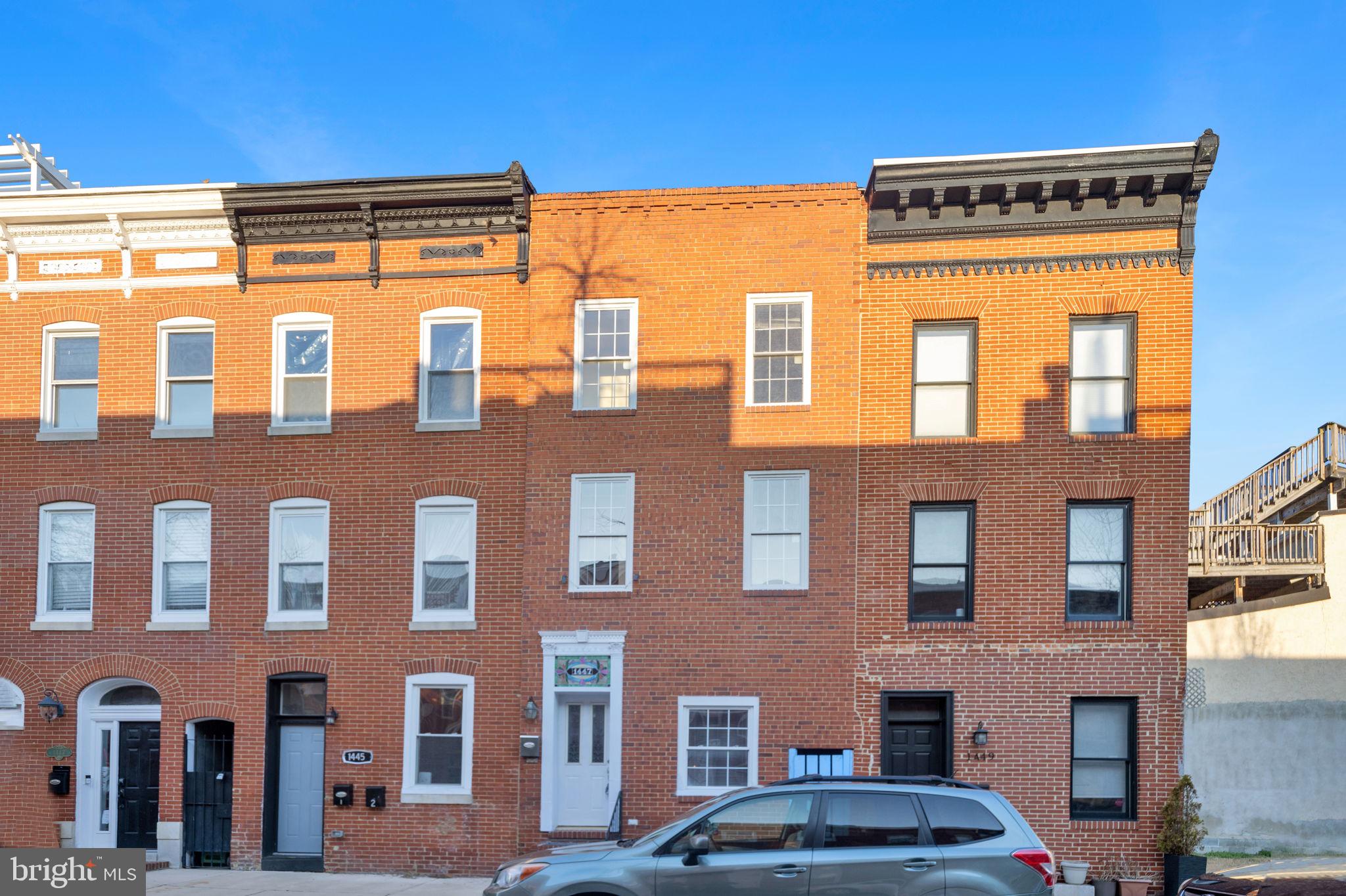 1447 William Street Baltimore, MD 21230 - Photo 64 of 65 a front view of a building with lot of cars