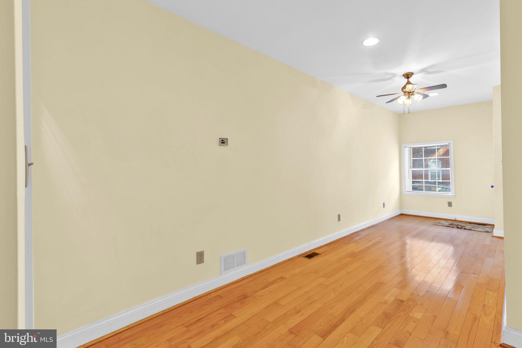 1447 William Street Baltimore, MD 21230 - Photo 9 of 65 an empty room with windows and fan