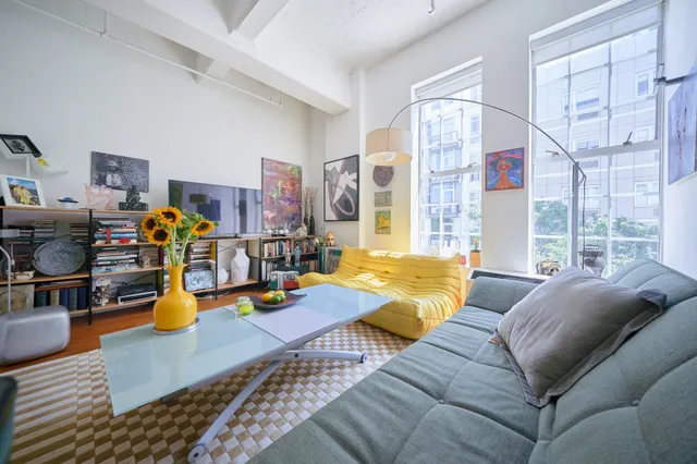 a living room with furniture and a table