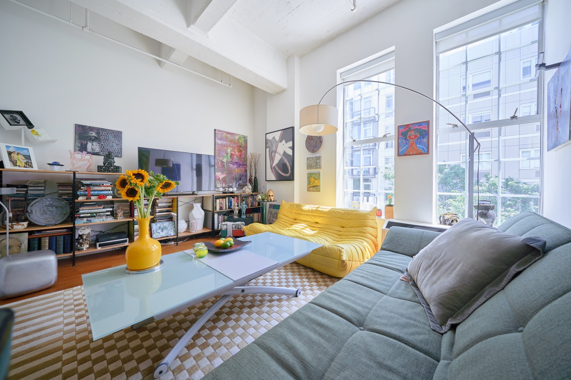 a living room with furniture and a table