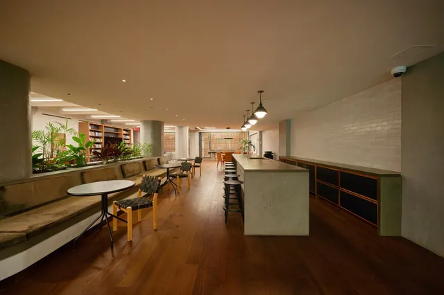 a bedroom with furniture and a rug