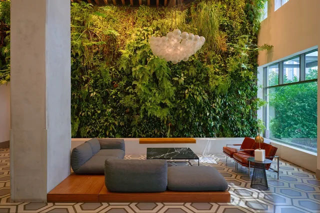 a room with wooden floors and lots of chairs