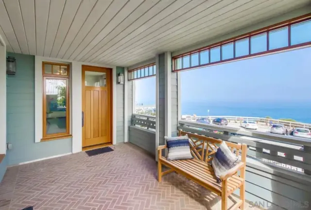 a view of a balcony with furniture