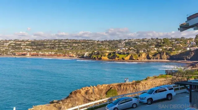 a view of a lake with houses in the back
