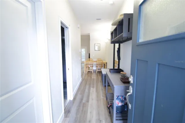 a view of living room with furniture and wooden floor